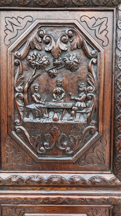 ORNATELY CARVED ARMOIRE WITH PAW FEET