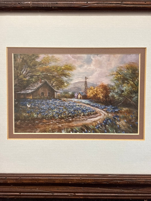 BROWN FRAMED WATERCOLOR OF HOUSE WITH BLUE BONNETS AND WHITE MATTE