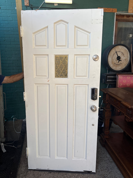 BLACK EXTERIOR DOOR WITH SMALL STAINED GLASS WINDOW