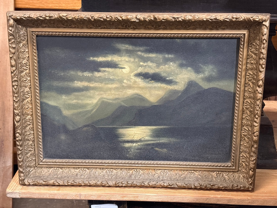 MEDIUM GILT FRAMED DARK LANDSCAPE WITH MOUNTAIN LAKE ON BOARD