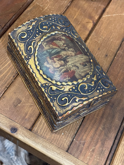 MEDIUM DARK GOLD DOMED FLORENTINE BOX WITH DECOUPAGE PAINTING OF WOMAN HOLDING CHILD IN ROOM OF PEOPLE
