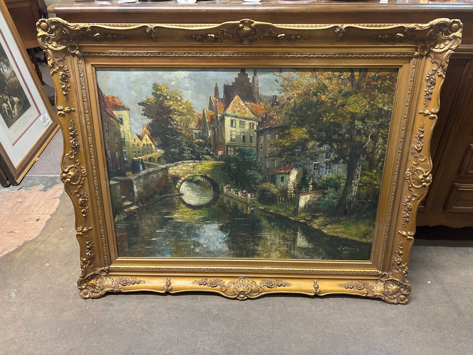 LARGE FRAMED OIL PAINTING OF A CANAL SCENE