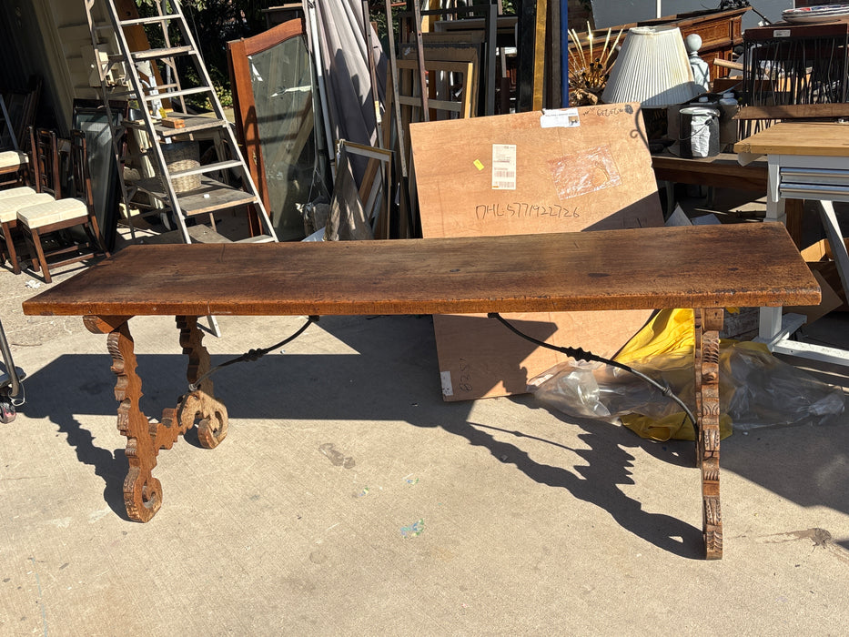 18TH CENTURY SPANISH BAROQUE TABLE WITH IRON STRETCHERS AND SINGLE BOARD TOP