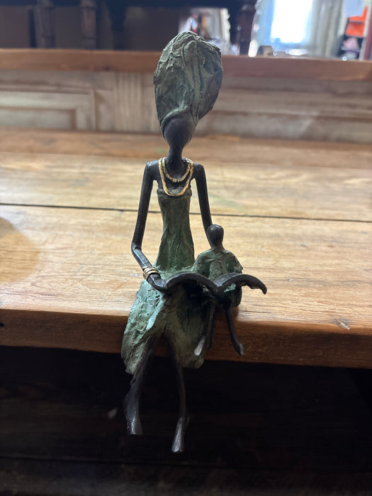 BRONZE MOTHER READING BOOK TO CHILD