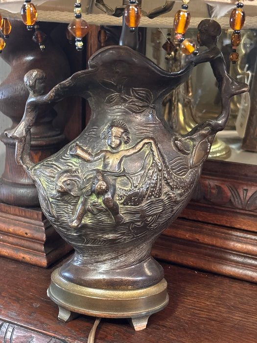 BRONZE LAMP OF CHILDREN RAISING EARTH AND SEA