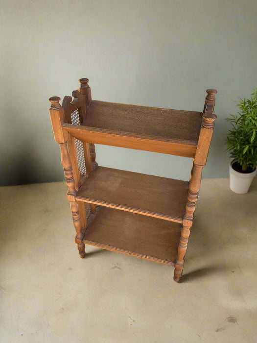 OAK BOOK TROUGH WITH CANED SIDES AND TURNED LEG