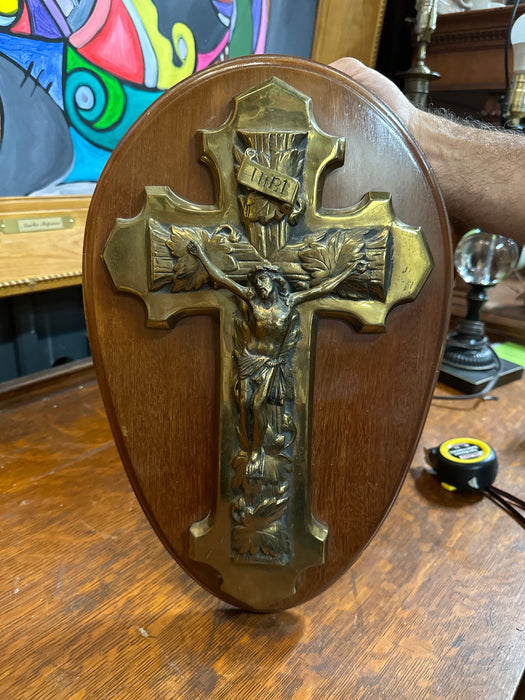 BRASS CRUCIFIX ON OVAL MAHOAGANY BACK