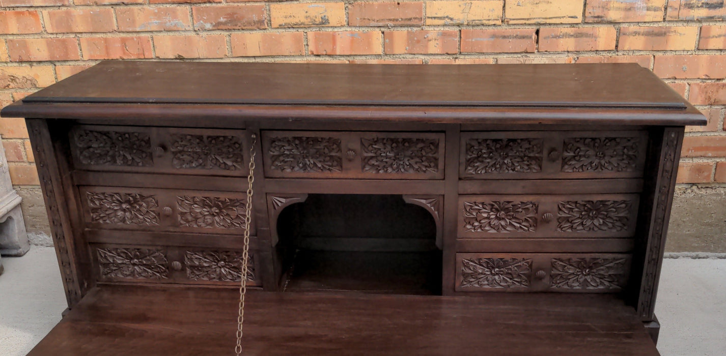 ITALIAN CABINET WITH CARVED LITTLE DRAWERS AND CARVED SIDES