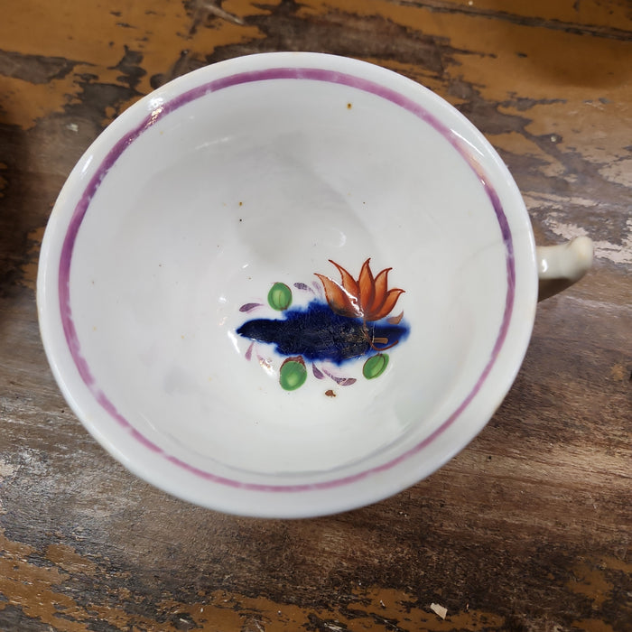 GAUDY DUTCH ENGLISH CUP AND SAUCER