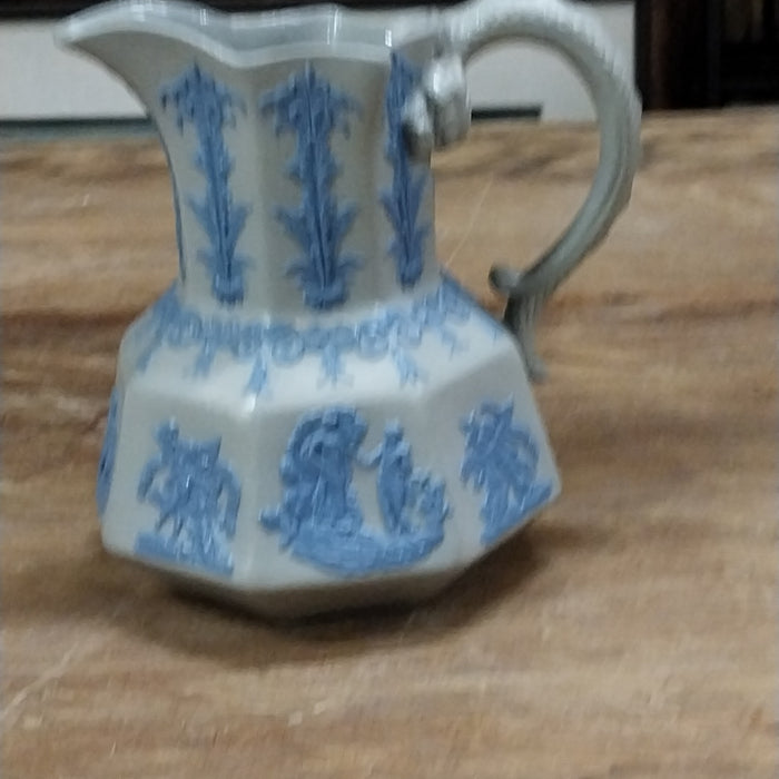 PITCHER WITH RELIEF