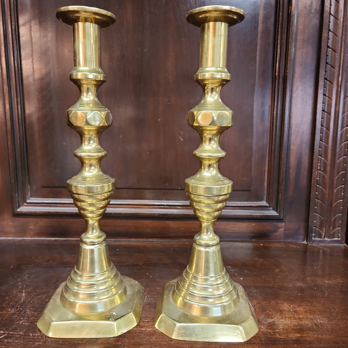 EARLY BRASS PRIMITIVE PUSH UP CANDLESTICKS PAIR