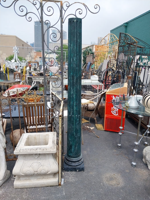 TALL GREEN CONCRETE COLUMN