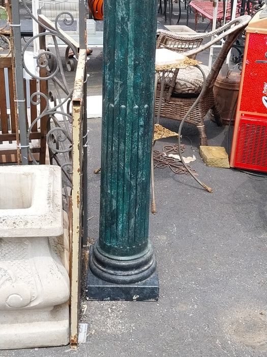 TALL GREEN CONCRETE COLUMN