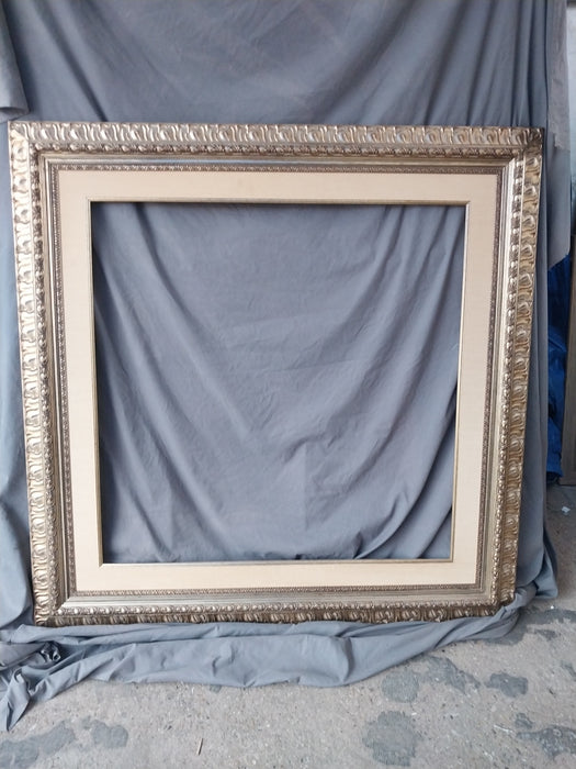 SILVER GILT CARVED WOOD FRAME