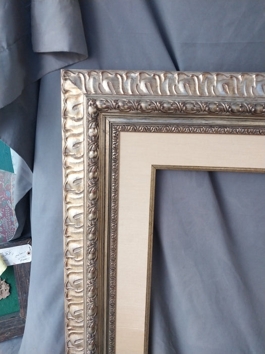 SILVER GILT CARVED WOOD FRAME