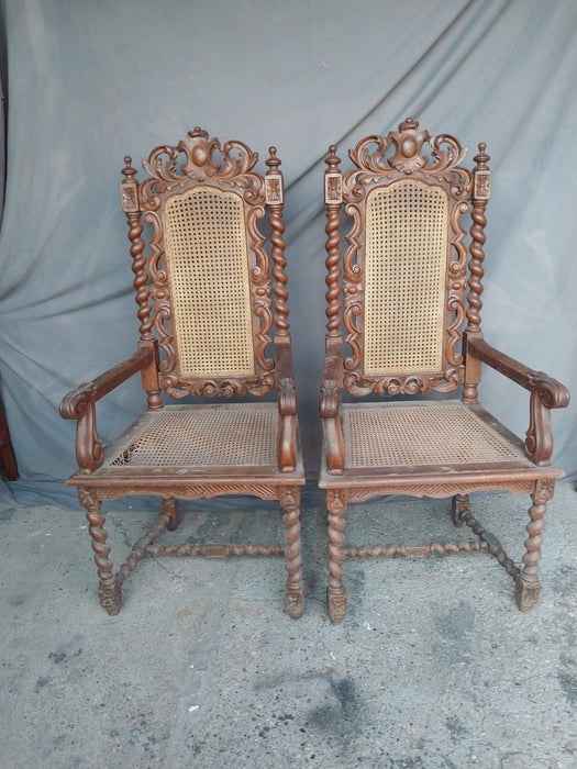 PAIR OF BARLEY TWIST CARVED ARM CHAIRS WITH CANED SEATS