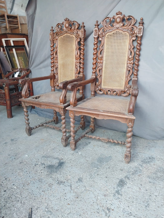 PAIR OF BARLEY TWIST CARVED ARM CHAIRS WITH CANED SEATS
