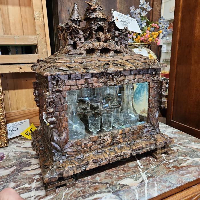 CARVED BLACK FOREST TANTULUS WITH CASTLE AND CRITTER