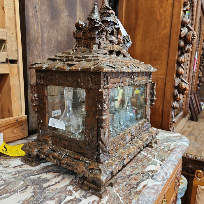 CARVED BLACK FOREST TANTULUS WITH CASTLE AND CRITTER