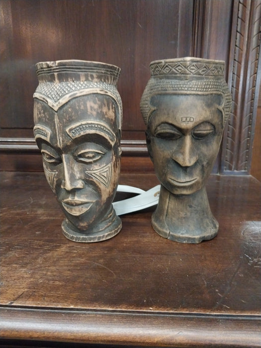PAIR OF AFRICAN CARVED WOOD FACE MUGS