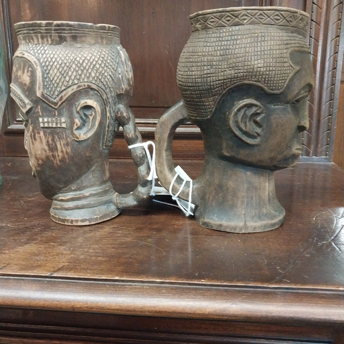 PAIR OF AFRICAN CARVED WOOD FACE MUGS