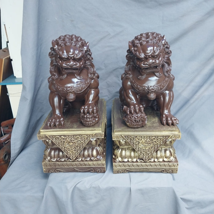 PAIR OF COMPOSITION FOO DOGS
