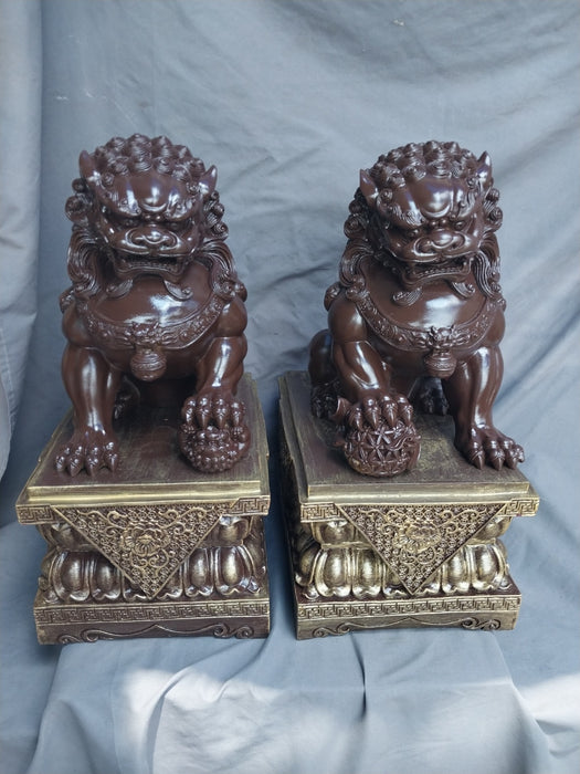 PAIR OF COMPOSITION FOO DOGS