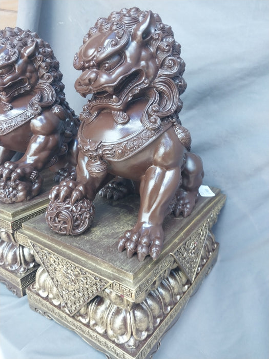 PAIR OF COMPOSITION FOO DOGS