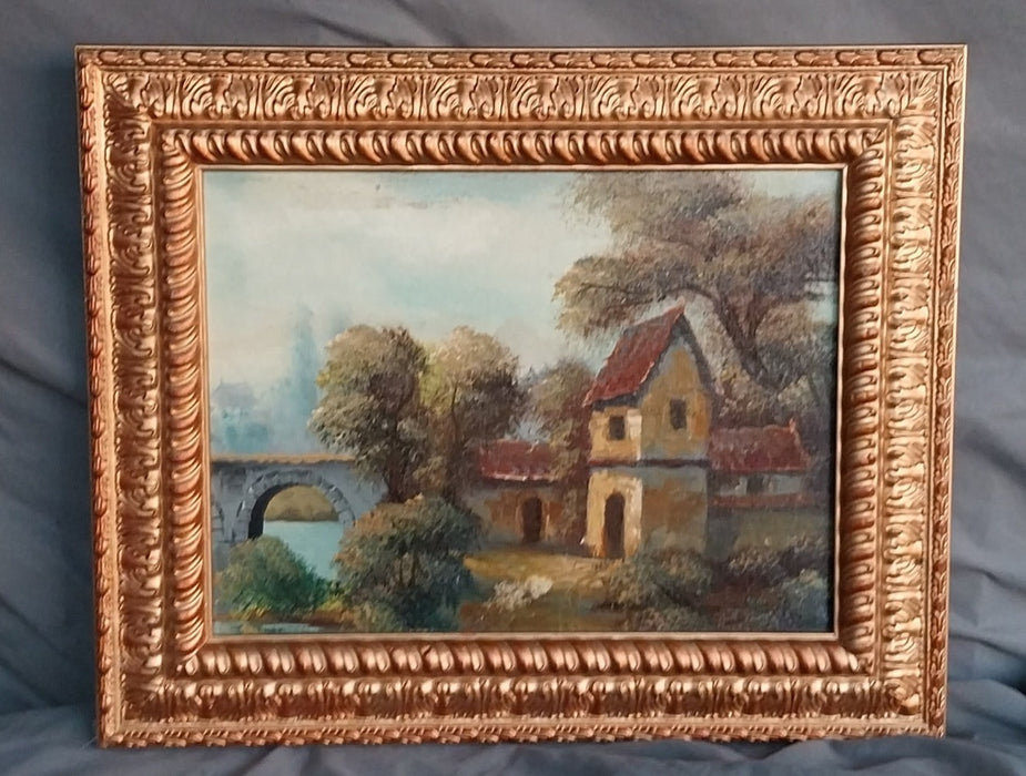 SMALL ORNATE FRAMED COTTAGE OIL PAINTING WITH BRIDGE