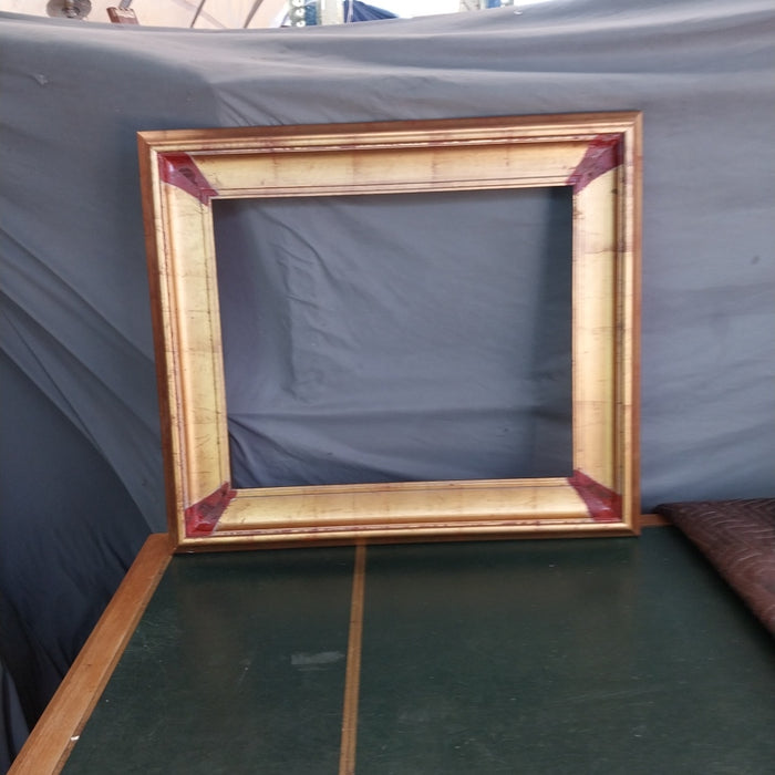 GOLD FRAME WITH BROWN CORNERS
