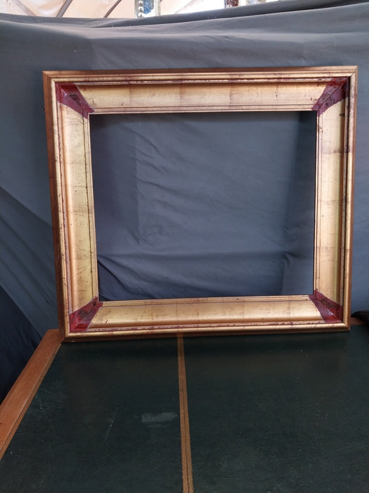 GOLD FRAME WITH BROWN CORNERS