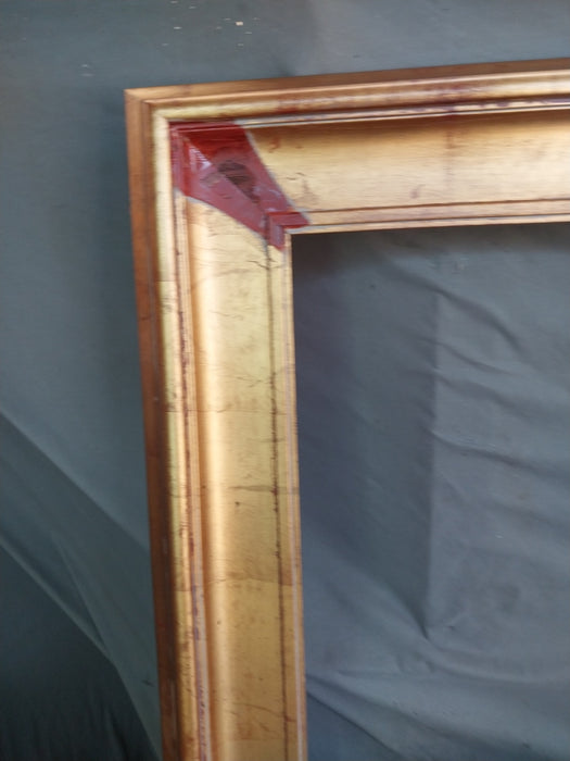 GOLD FRAME WITH BROWN CORNERS