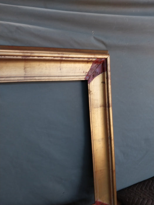 GOLD FRAME WITH BROWN CORNERS