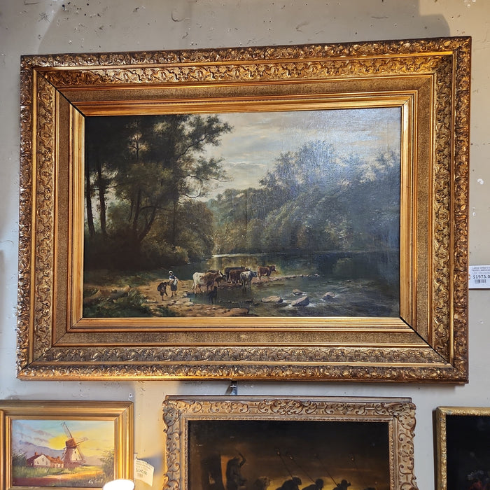 LARGE ORNATE GILT FRAMED RIVER LANDSCAPE WITH CATTLE