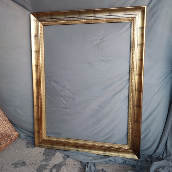 LARGE GILT FRAME WITH BLACK WASH
