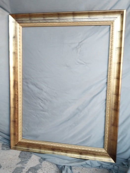 LARGE GILT FRAME WITH BLACK WASH