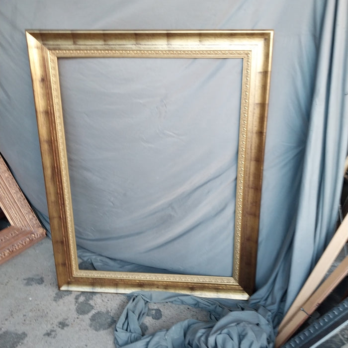 LARGE GILT FRAME WITH BLACK WASH