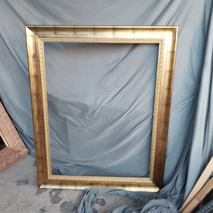 LARGE GILT FRAME WITH BLACK WASH