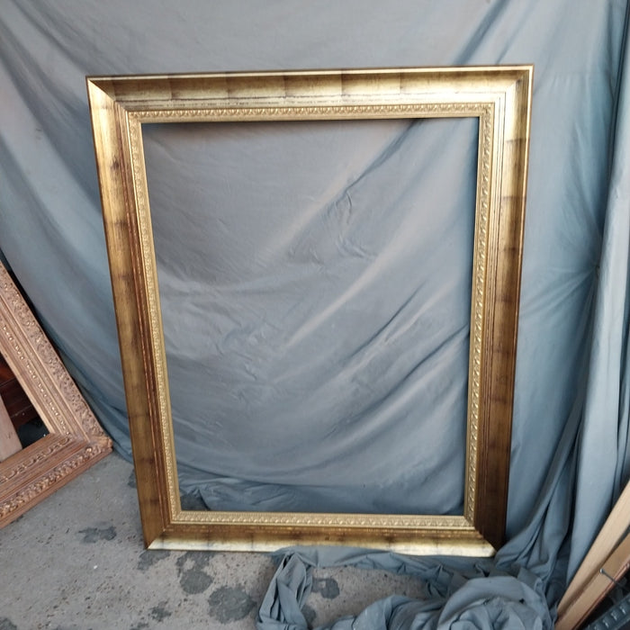 LARGE GILT FRAME WITH BLACK WASH