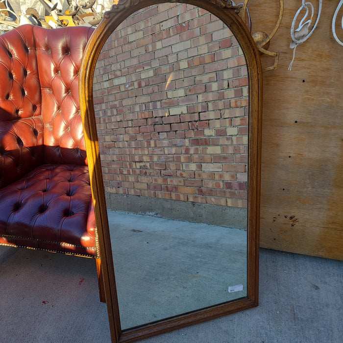TALL ARCHED OAK MIRROR WITH CARVED PEDIMENT
