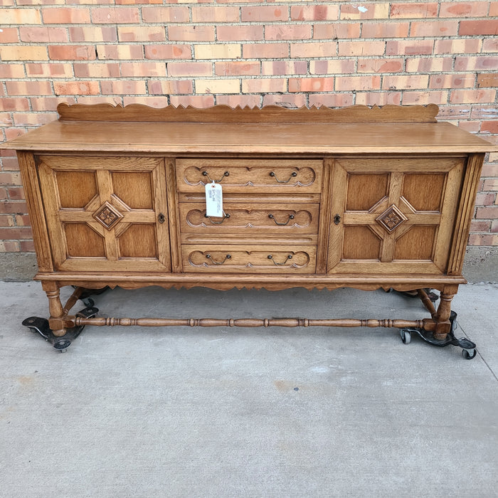 TUDOR LOW OAK PANELED SIDEBOARD WITH STRETCHER