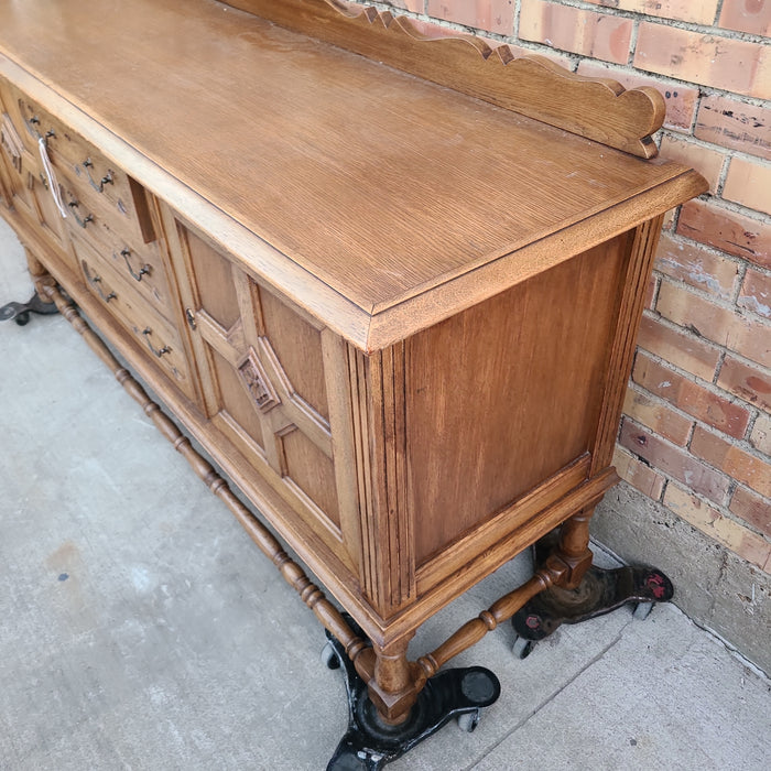 TUDOR LOW OAK PANELED SIDEBOARD WITH STRETCHER