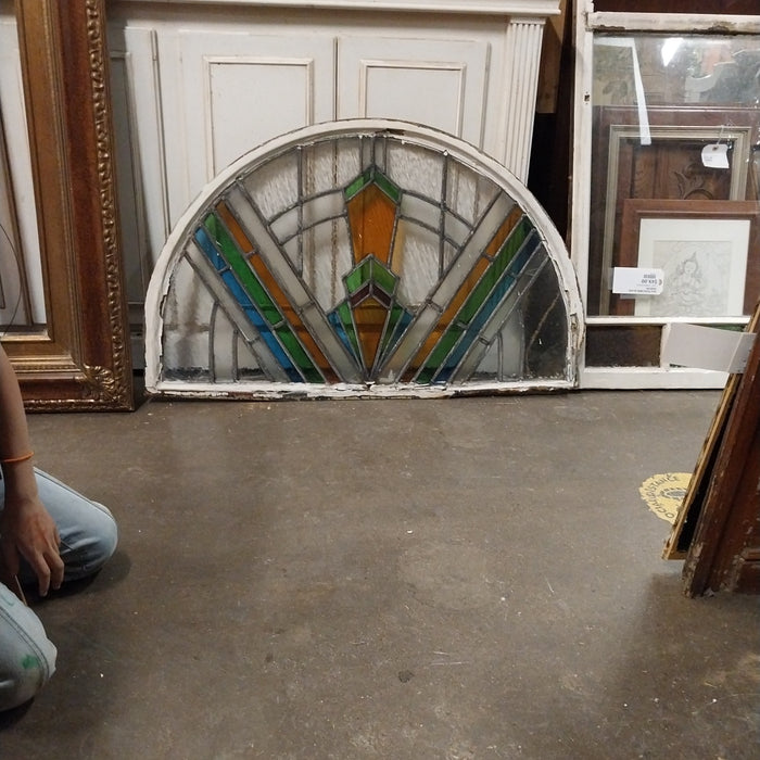 ARCHED STAIN GLASS WINDOW IN METAL FRAME AS FOUND