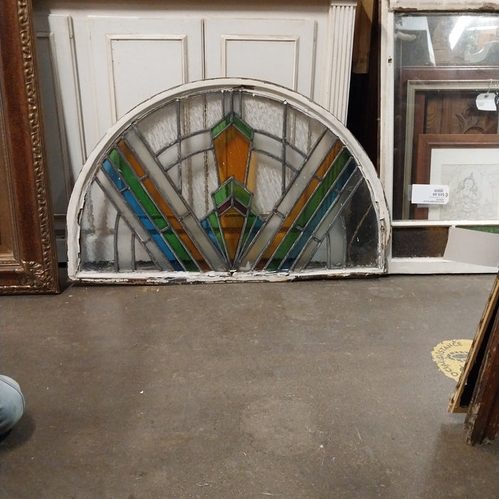 ARCHED STAIN GLASS WINDOW IN METAL FRAME AS FOUND