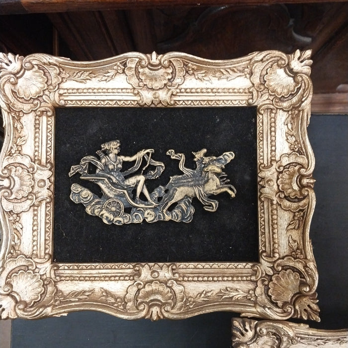 PAIR OF VINTAGE PLASTIC FLORAL CHARIOTS ON VELVET