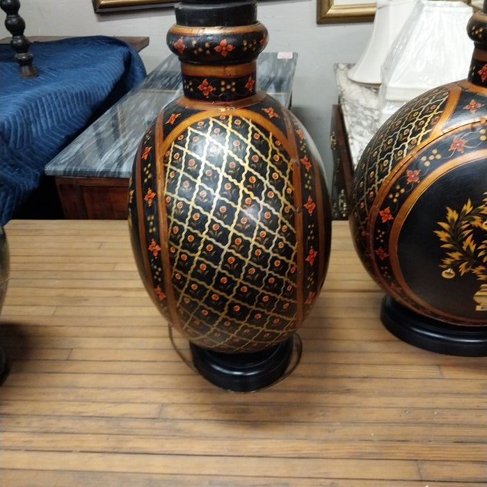 PAIR OF BLACK AND ORANGE INDIAN LAMPS