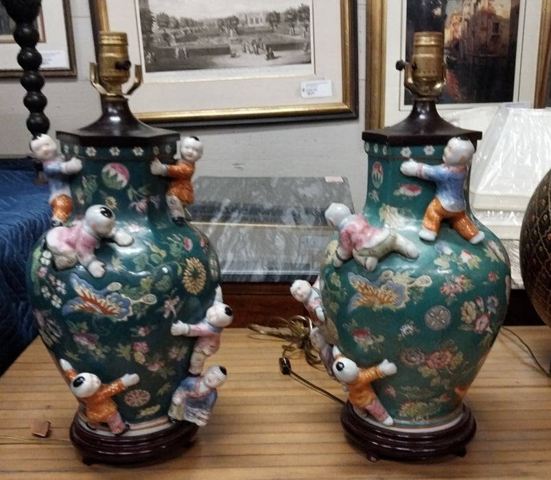 PAIR OF DARK GREEN FIGURAL CHINESE LAMPS