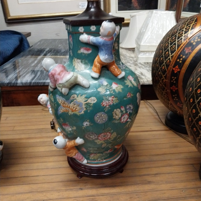 PAIR OF DARK GREEN FIGURAL CHINESE LAMPS