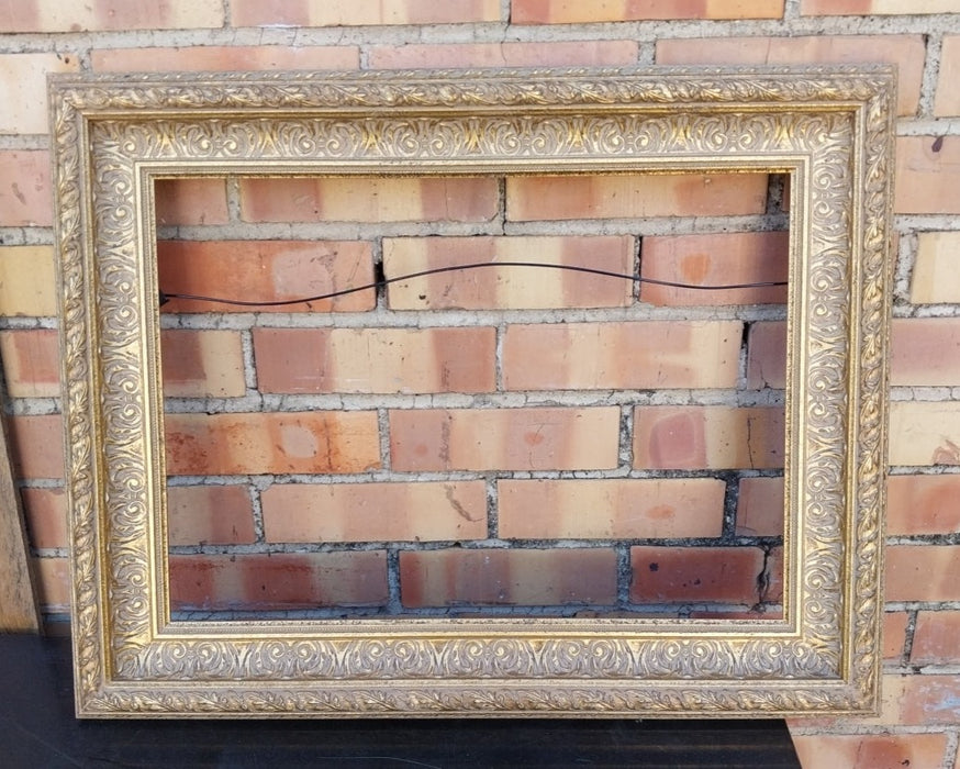 SMALL ORNATE GILT FRAME WITH LEAF TRIM