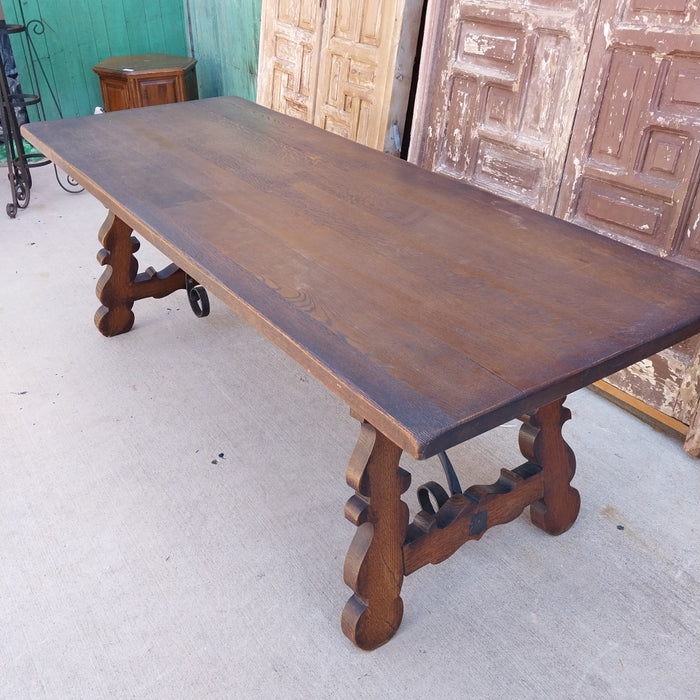 LARGE DARK OAK SPANISH IRON TRESTLE BASE TABLE